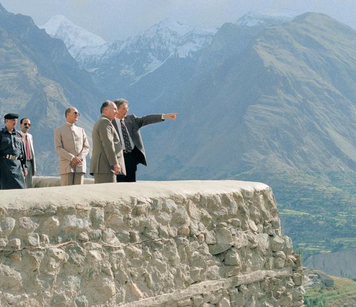 His Highness the Aga Khan, admiring the breath-taking view from the Baltit Fort, northern Paksitan, in conversation with Stefano Bianco, Director of Historic Cities Support Programme, part of the Aga Khan Trust for Culture. Prince Amyn Aga Khan looks on. 1996. The conservation of the over 700 years old Baltit Fort, the pre-eminent landmark onument in Gilgit-Baltistan, and the rehabilitation of the historic core of the Karimabad village in the Hunza Valley, were the Aga Khan Historic Cities Programme first major interventions, completed in 1996. These projects, as well as others in neighbouring Baltistan, have won a number of prestigious prizes, including the UNESCO Asia-Pacific Heritage Awards for Cultural Heritage Conservation (every year between 2002 and 2013); a Time Magazine “Best of Asia”; and a British Airways Tourism for Tomorrow Award. The Aga Khan Trust for Culture has completed dozens of other restoration projects in Baltistan and Hunza, but the area remains a treasure trove of scores of shrines, forts, mosques and other buildings of cultural and historical significance. - Photo credit: AKDN / Gary Otte