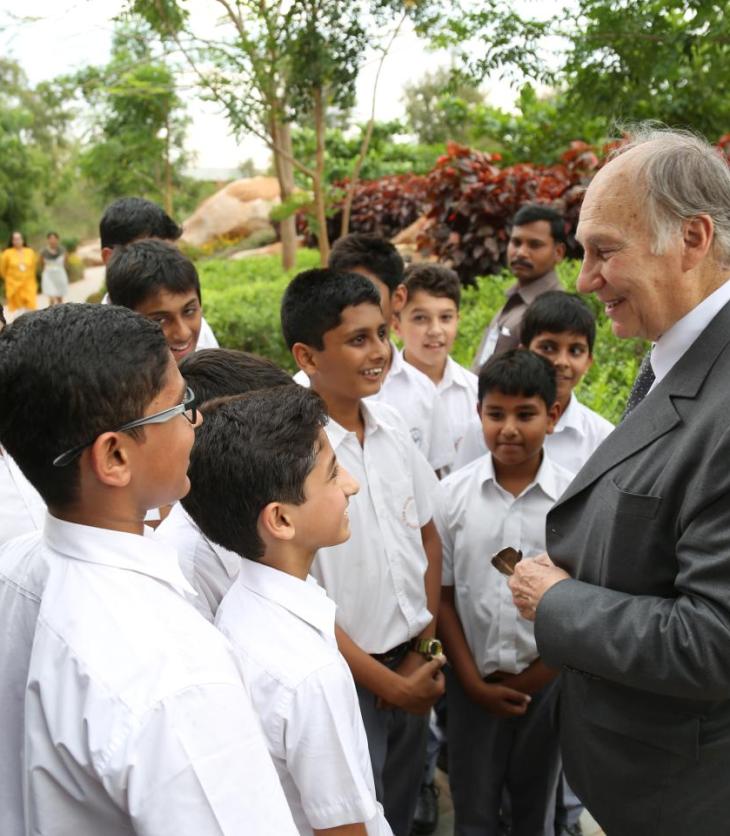 His Highness the Aga Khan meets a group of students on the campus of the Aga Khan Academy, Hyderabad, India, 10 April 2015. The Aga Khan Academies are a network of schools being established by His Highness the Aga Khan in countries accross South and Central Asia, Africa and the Middle East. - Photo credit: AKDN / Ahmed Charania