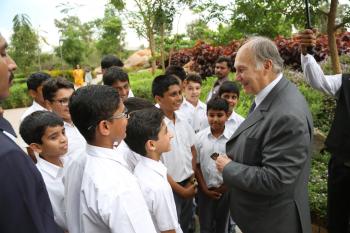 His Highness the Aga Khan meets a group of students on the campus of the Aga Khan Academy, Hyderabad, India, 10 April 2015. The Aga Khan Academies are a network of schools being established by His Highness the Aga Khan in countries accross South and Central Asia, Africa and the Middle East. - Photo credit: AKDN / Ahmed Charania
