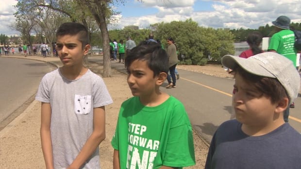 Lessons in compassion from children at world anti-poverty walk in Regina | CBC News