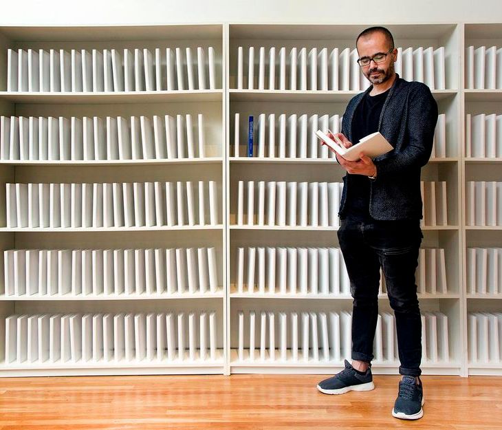 Iraqi-American artist Wafaa Bilal poses with his project 168:01 at the Aga Khan museum, July 17, 2018. Bilal's work is an open appeal to rebuild the Iraqi School of Fine Arts' library, book by book. (ANDREW FRANCIS WALLACE / TORONTO STAR)