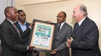 Dar es Salaam, Tanzania. October 12, 2017: Before departing Tanzania, His Highness Prince Karim Aga Khan IV was presented with a gift of First Day Covers and Commemorative Stamps printed by the Tanzania Postal Service Corporation in honour of his Diamond Jubilee. The First Day Covers and Commemorative stamps depict various themes in which AKDN is active in East Africa, as well as the Diamond Jubilee motif.. Image credit: Zahur Ramji via The Ismaili